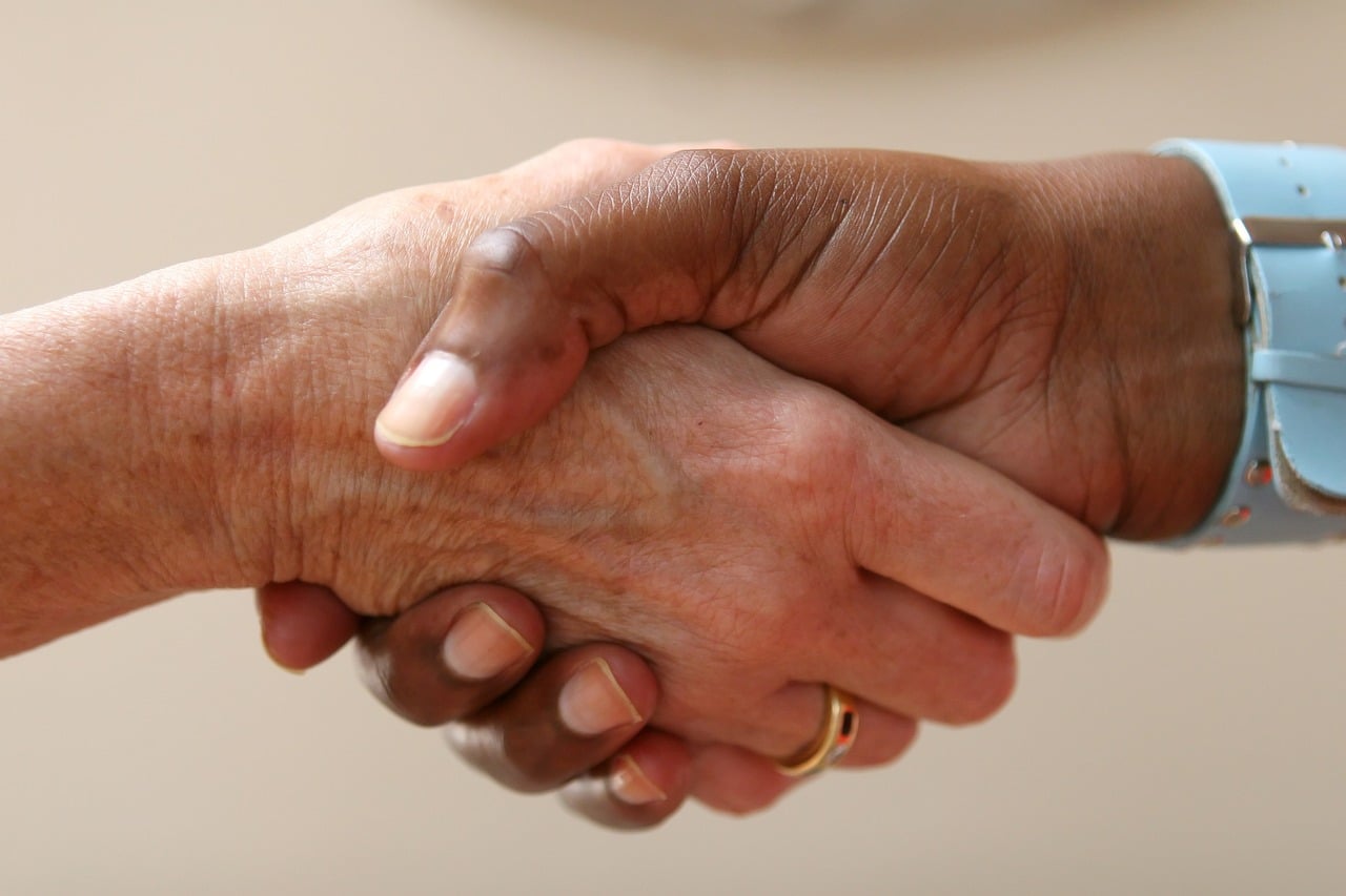 Unity Through A Handshake image in article How can Nevada child care programs make parents true partners?